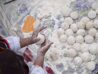 An Iranian nomadic woman works with dough while participating in the 11th National Handicrafts and 3rd International Tourism Exhibition in T...