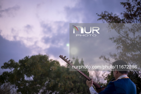 An Iranian musician plays a traditional musical instrument while participating in the 11th National Handicrafts and 3rd International Touris...