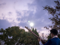 An Iranian musician plays a traditional musical instrument while participating in the 11th National Handicrafts and 3rd International Touris...