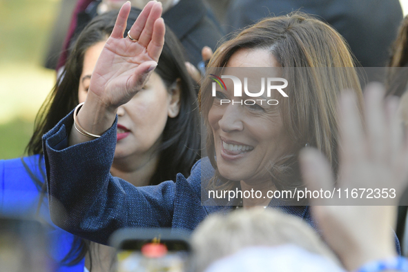 U.S. Vice President Kamala Harris greets supporters after a campaign event, standing with a group of current and former Republicans, at Wash...