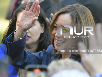 U.S. Vice President Kamala Harris greets supporters after a campaign event, standing with a group of current and former Republicans, at Wash...