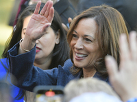 U.S. Vice President Kamala Harris greets supporters after a campaign event, standing with a group of current and former Republicans, at Wash...