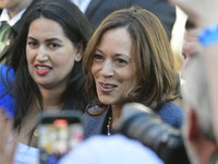 U.S. Vice President Kamala Harris greets supporters after a campaign event, standing with a group of current and former Republicans, at Wash...