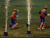 Dilshan Munaweera and Richard Levi walk towards the crease to open the batting for Konark Suryas Odisha during the finals of the Legends Lea...