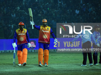 Yusuf Pathan raises his bat after scoring 50 runs during the finals of the Legends League Cricket T20 match between Southern Superstars and...