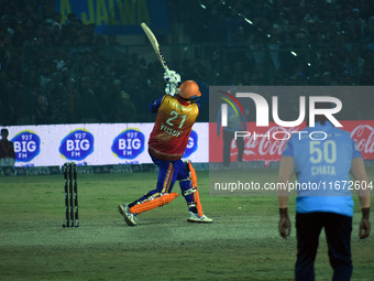 Yusuf Pathan (L) hits a six during the finals of the Legends League Cricket T20 match between Southern Superstars and Konark Suryas Odisha a...