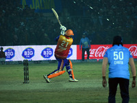 Yusuf Pathan (L) hits a six during the finals of the Legends League Cricket T20 match between Southern Superstars and Konark Suryas Odisha a...