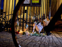 People gather to pay tribute to Paul, a 27-year-old cyclist who was run over by a car following a dispute in Paris one day earlier, at Place...