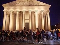 People gather to pay tribute to Paul, a 27-year-old cyclist who was run over by a car following a dispute in Paris one day earlier, at Place...