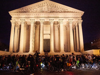 People gather to pay tribute to Paul, a 27-year-old cyclist who was run over by a car following a dispute in Paris one day earlier, at Place...