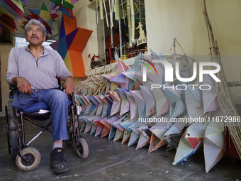 David Galicia, an artisan, prepares to repair, make, and sell the stars of the animas in Mexico City, Mexico, on October 16, 2024, made of r...