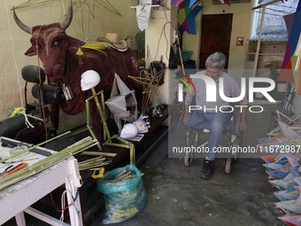 David Galicia, an artisan, prepares to repair, make, and sell the stars of the animas in Mexico City, Mexico, on October 16, 2024, made of r...