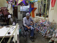 David Galicia, an artisan, repairs dolls and stars of the animas in Mexico City, Mexico, on October 16, 2024, made with this material and co...