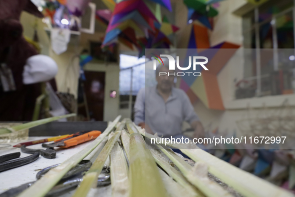 Inside the workshop of David Galicia, an artisan who makes, repairs, and sells animas stars in Mexico City, Mexico, on October 16, 2024. The...