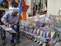 David Galicia, an artisan, repairs stars of the animas in Mexico City, Mexico, on October 16, 2024, made with this material and corn husks t...