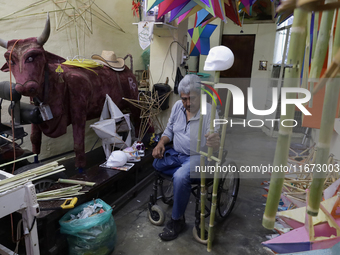 David Galicia, an artisan, repairs dolls and stars of the animas in Mexico City, Mexico, on October 16, 2024, made with this material and co...