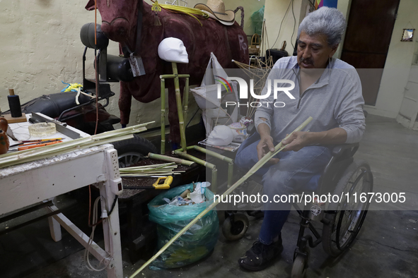 David Galicia, an artisan, cuts reeds for the repair, elaboration, and sale of stars of the animas in Mexico City, Mexico, on October 16, 20...