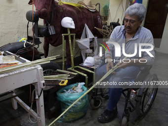 David Galicia, an artisan, cuts reeds for the repair, elaboration, and sale of stars of the animas in Mexico City, Mexico, on October 16, 20...