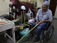 David Galicia, an artisan, cuts reeds for the repair, elaboration, and sale of stars of the animas in Mexico City, Mexico, on October 16, 20...