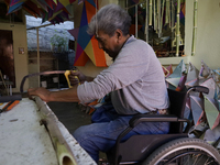 David Galicia, an artisan, cuts reeds for the repair, elaboration, and sale of stars of the animas in Mexico City, Mexico, on October 16, 20...