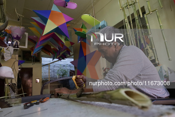 David Galicia, an artisan, cuts reeds for the repair, elaboration, and sale of stars of the animas in Mexico City, Mexico, on October 16, 20...