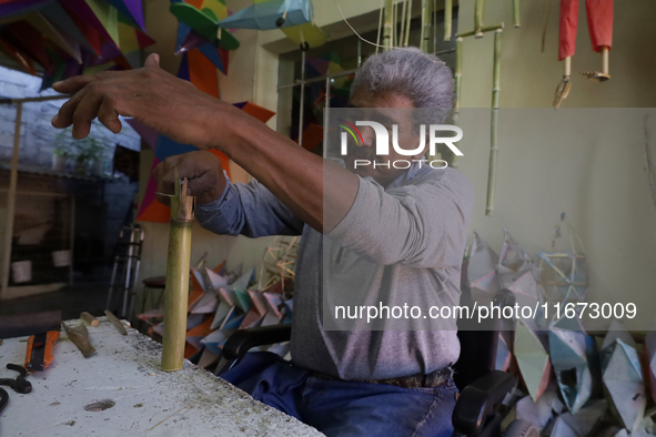 David Galicia, an artisan, cuts reeds for the repair, elaboration, and sale of stars of the animas in Mexico City, Mexico, on October 16, 20...