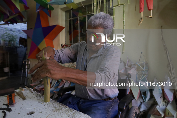 David Galicia, an artisan, cuts reeds for the repair, elaboration, and sale of stars of the animas in Mexico City, Mexico, on October 16, 20...