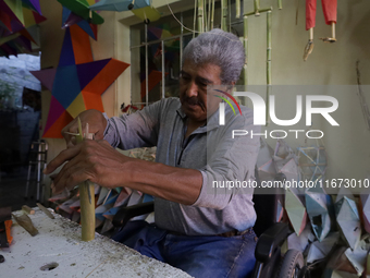 David Galicia, an artisan, cuts reeds for the repair, elaboration, and sale of stars of the animas in Mexico City, Mexico, on October 16, 20...