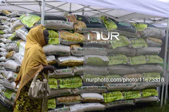 A woman walks past a stand loaded with Eko Rice as the Lagos State Ministry of Agriculture and Food Systems concludes activities for the 202...