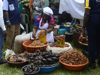 A woman measures crayfish as the Lagos State Ministry of Agriculture and Food Systems concludes activities marking the 2024 World Food Day,...