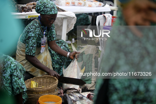 A woman cuts fish as the Lagos State Ministry of Agriculture and Food Systems concludes activities for the 2024 World Food Day, tagged Eko W...