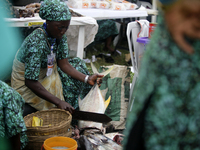 A woman cuts fish as the Lagos State Ministry of Agriculture and Food Systems concludes activities for the 2024 World Food Day, tagged Eko W...