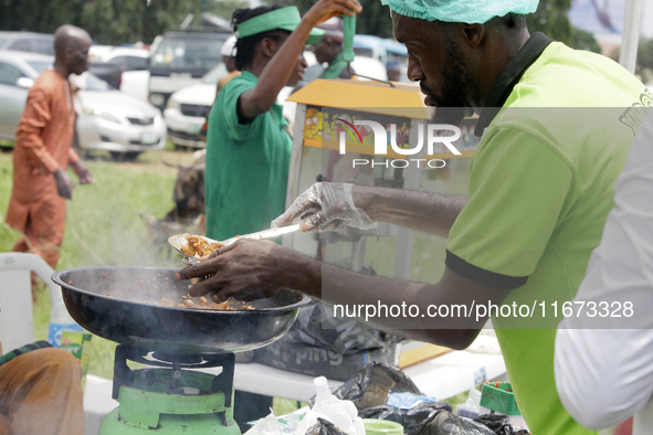 A man serves fried meat as the Lagos State Ministry of Agriculture and Food Systems concludes activities for the 2024 World Food Day, called...