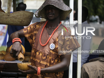 A man pours palm wine as the Lagos State Ministry of Agriculture and Food Systems concludes activities for the 2024 World Food Day, called E...