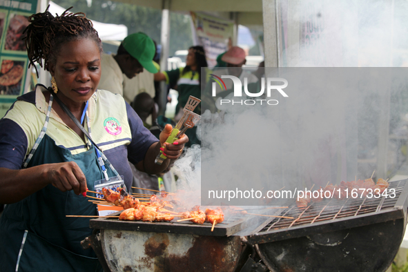 A woman prepares pork as the Lagos State Ministry of Agriculture and Food Systems concludes activities marking 2024 World Food Day, tagged E...