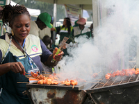 A woman prepares pork as the Lagos State Ministry of Agriculture and Food Systems concludes activities marking 2024 World Food Day, tagged E...