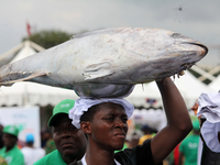 A farmer carries fish as the Lagos State Ministry of Agriculture and Food Systems concludes activities for the 2024 World Food Day, tagged E...