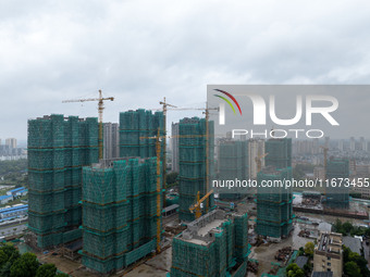 A real estate project is under construction in Qingjiangpu District, Huai'an City, Jiangsu Province, China, on October 17, 2024. (