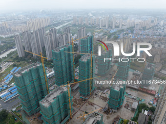 A real estate project is under construction in Qingjiangpu District, Huai'an City, Jiangsu Province, China, on October 17, 2024. (