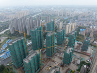 A real estate project is under construction in Qingjiangpu District, Huai'an City, Jiangsu Province, China, on October 17, 2024. (