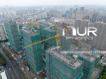 A real estate project is under construction in Qingjiangpu District, Huai'an City, Jiangsu Province, China, on October 17, 2024. (