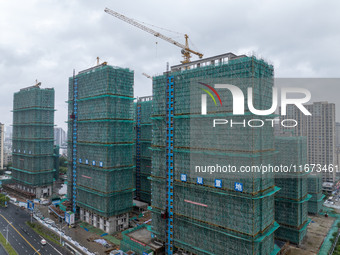 A real estate project is under construction in Qingjiangpu District, Huai'an City, Jiangsu Province, China, on October 17, 2024. (