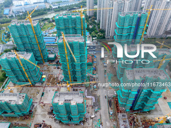 A real estate project is under construction in Qingjiangpu District, Huai'an City, Jiangsu Province, China, on October 17, 2024. (