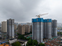 A real estate project is under construction in Qingjiangpu District, Huai'an City, Jiangsu Province, China, on October 17, 2024. (