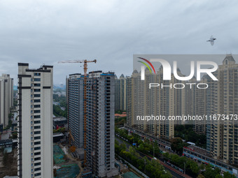 A real estate project is under construction in Qingjiangpu District, Huai'an City, Jiangsu Province, China, on October 17, 2024. (