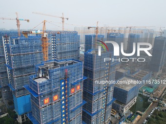 An aerial view shows a building under construction in Hangzhou, China, on October 17, 2024. (