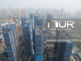 An aerial view shows a building under construction in Hangzhou, China, on October 17, 2024. (