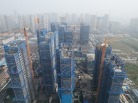 An aerial view shows a building under construction in Hangzhou, China, on October 17, 2024. (