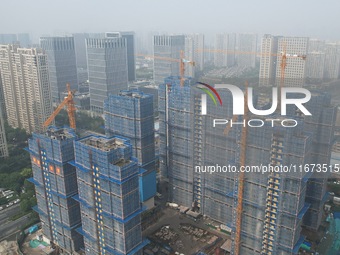 An aerial view shows a building under construction in Hangzhou, China, on October 17, 2024. (