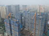 An aerial view shows a building under construction in Hangzhou, China, on October 17, 2024. (